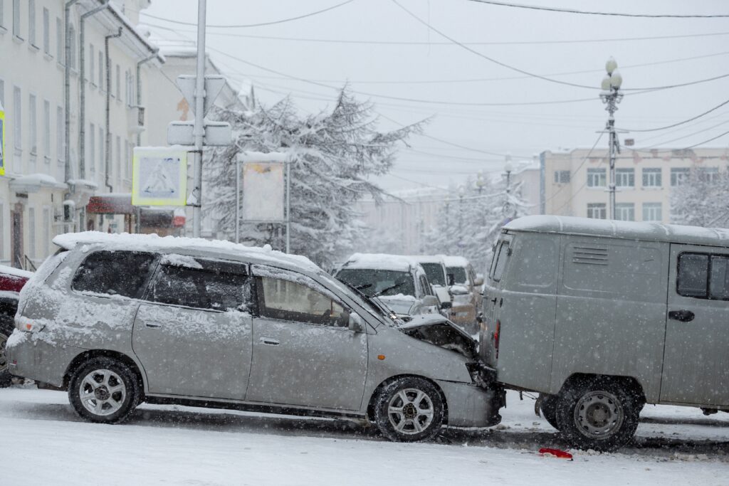 Portland Maine road covered in ice showing risk of crash and potential city liability for untreated roads.